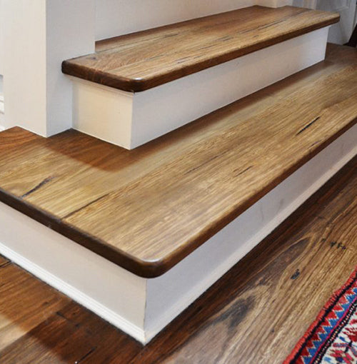 Wooden stairs with oak stair nosing, showcasing the craftsmanship and quality of Elite Wooden Floors' engineered oak products.